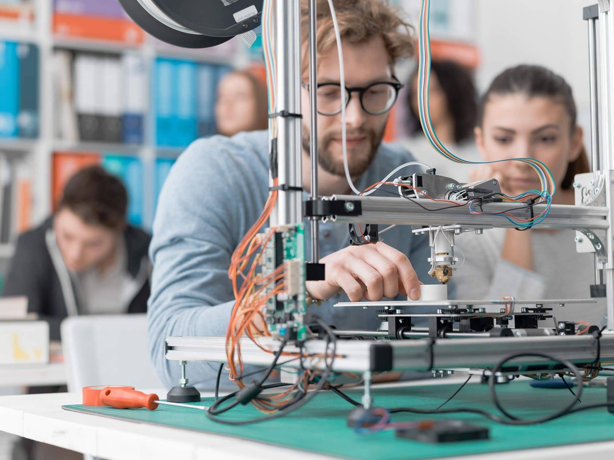 Technician working on electronic components in a laboratory