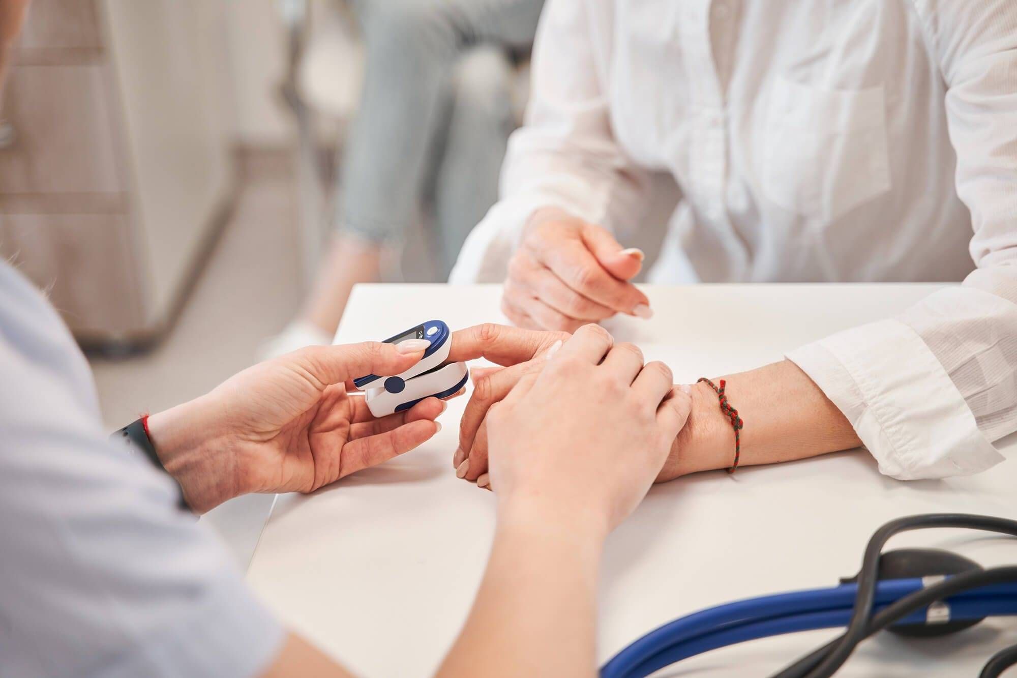 Healthcare worker checking a patient's blood pressure