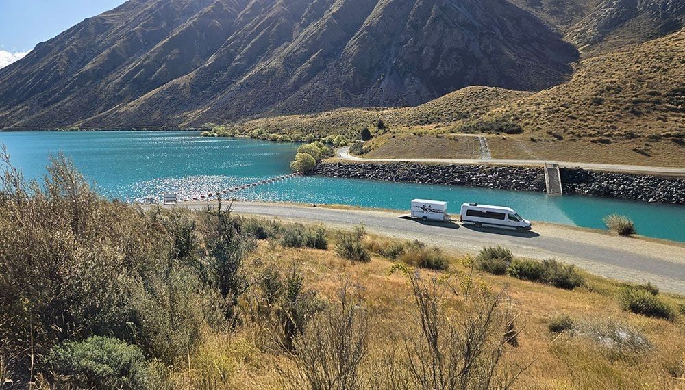 Our van and trailer driving through the picturesque South Island of New Zealand