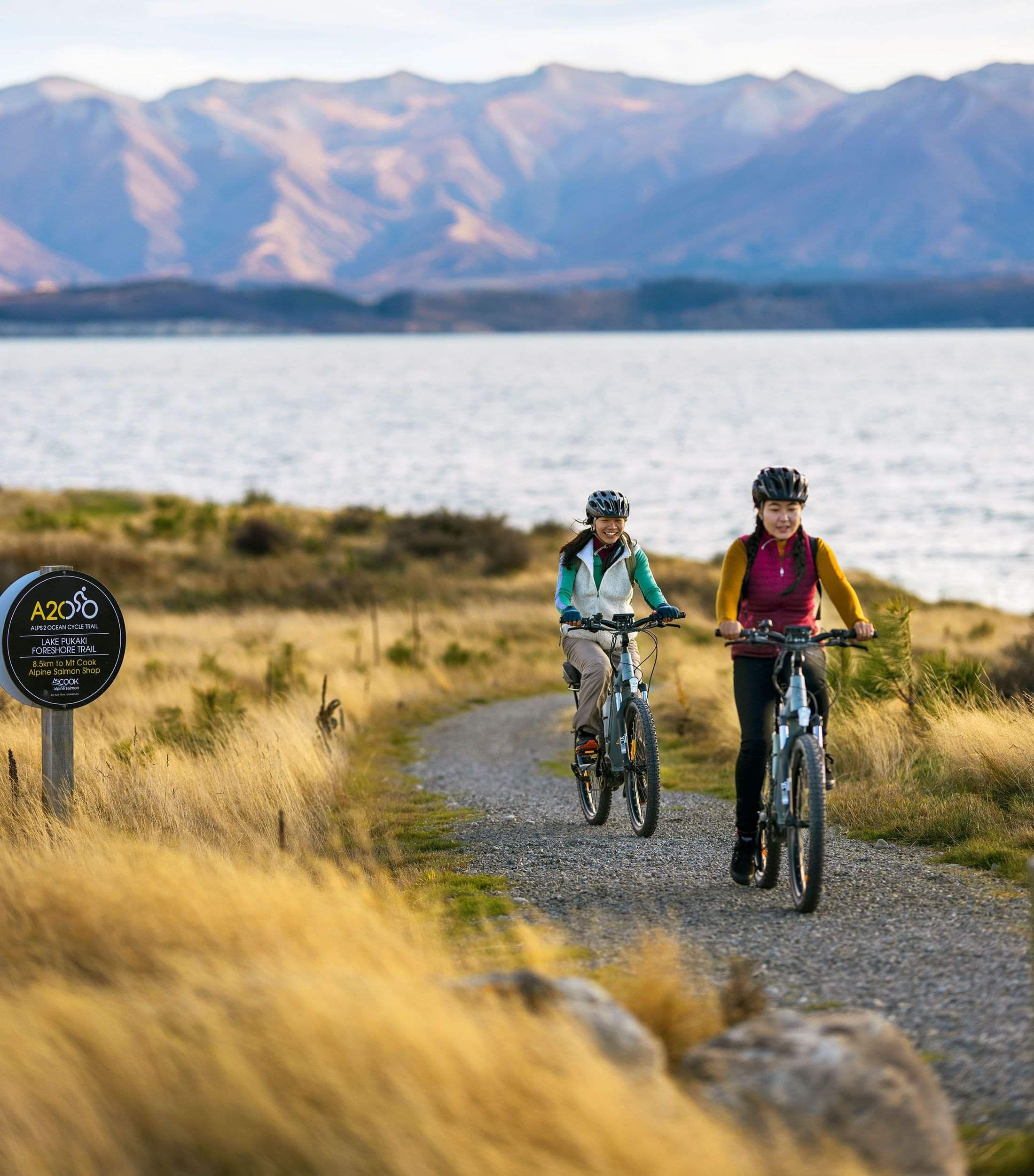 two riders ride the trails of the Alps 2 Ocean · 8-day tour