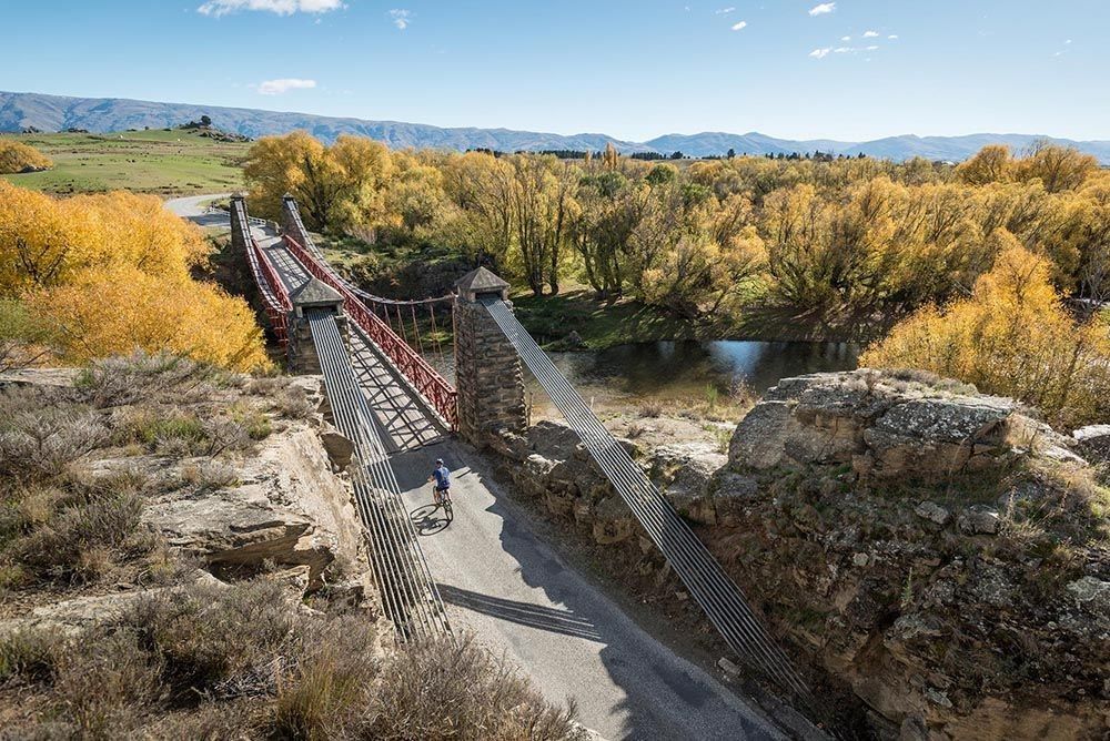 An old rail suspension bridge along the Otago Central Rail Trail