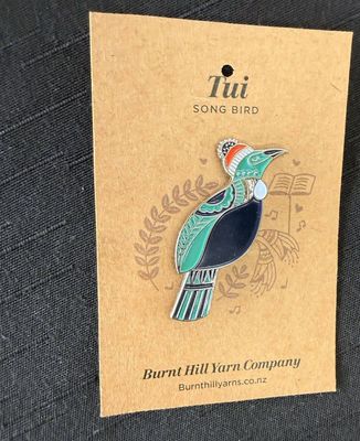 Tui shaped enamel pin
