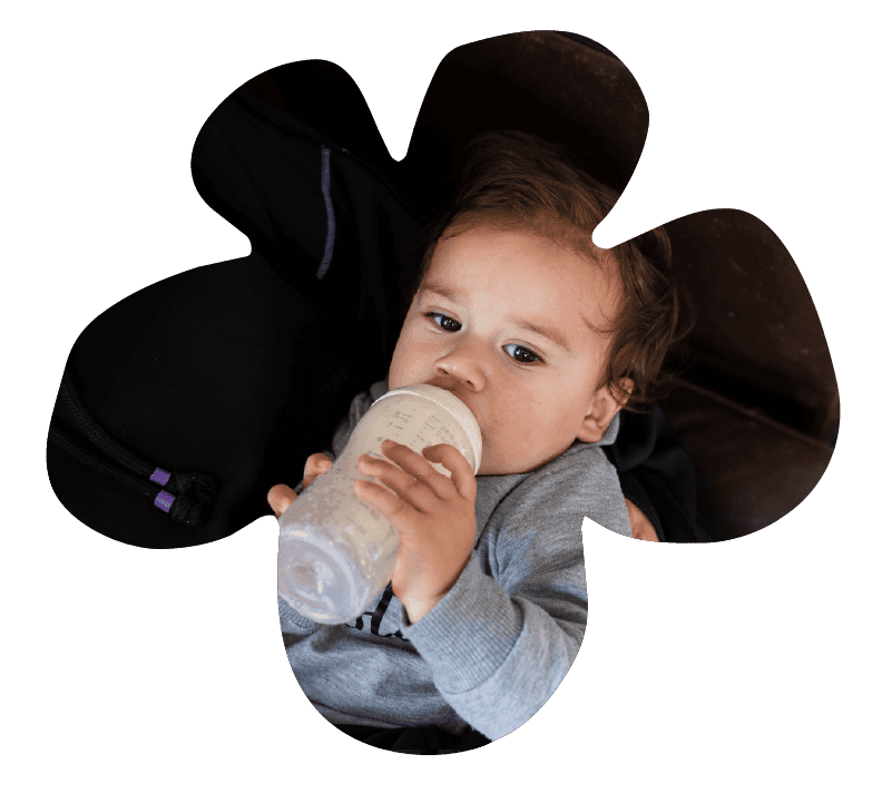 A baby drinking from a bottle at Sunshine on Sunshine.
