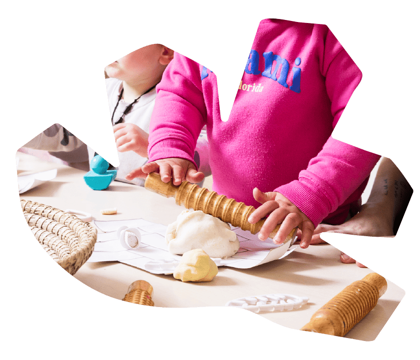A child rolling playdough during a hands-on activity at Sunshine on Sunshine.