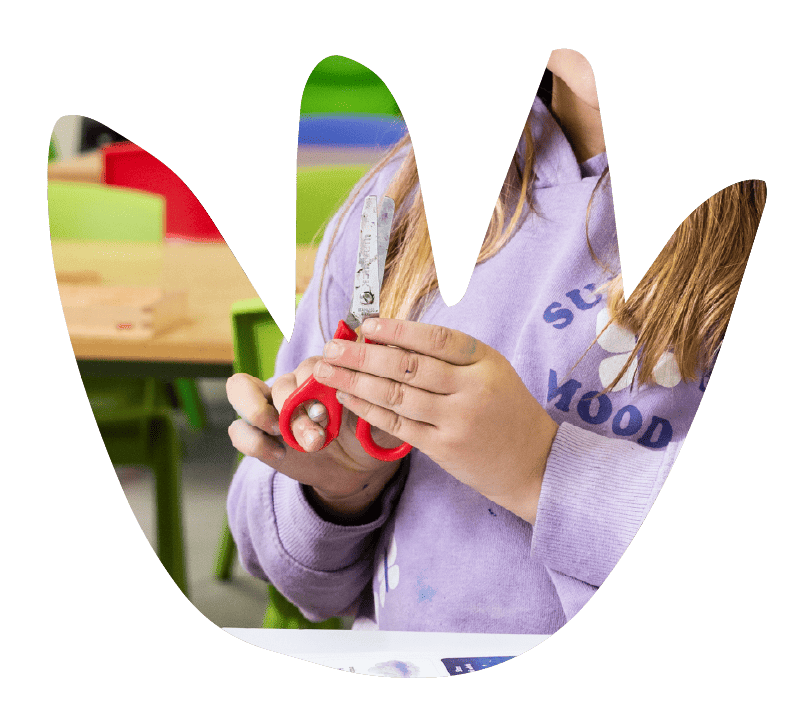 A child practising scissor skills at Sunshine on Sunshine.