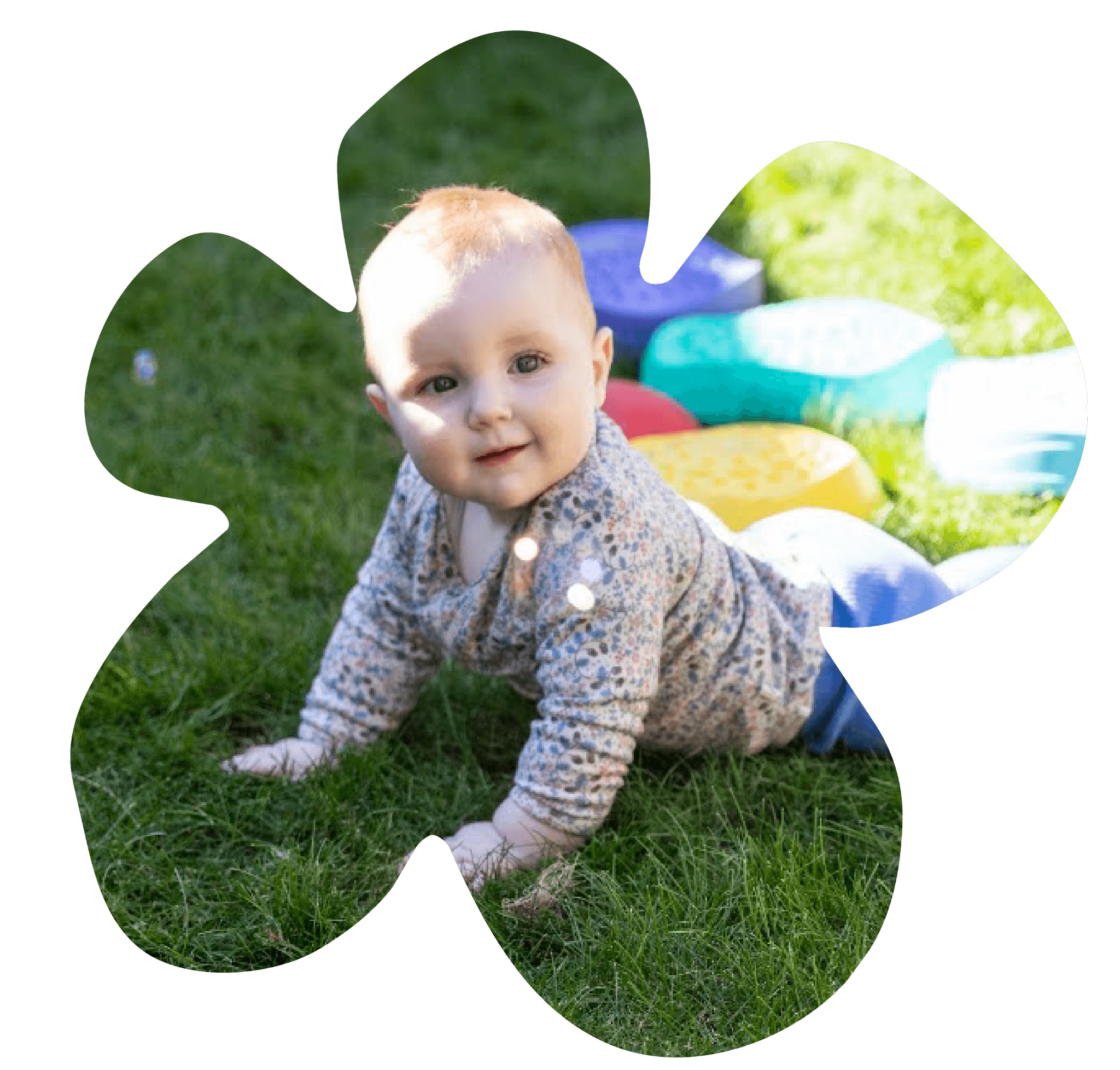 A baby exploring the grass outdoors at Sunshine on Vickery.