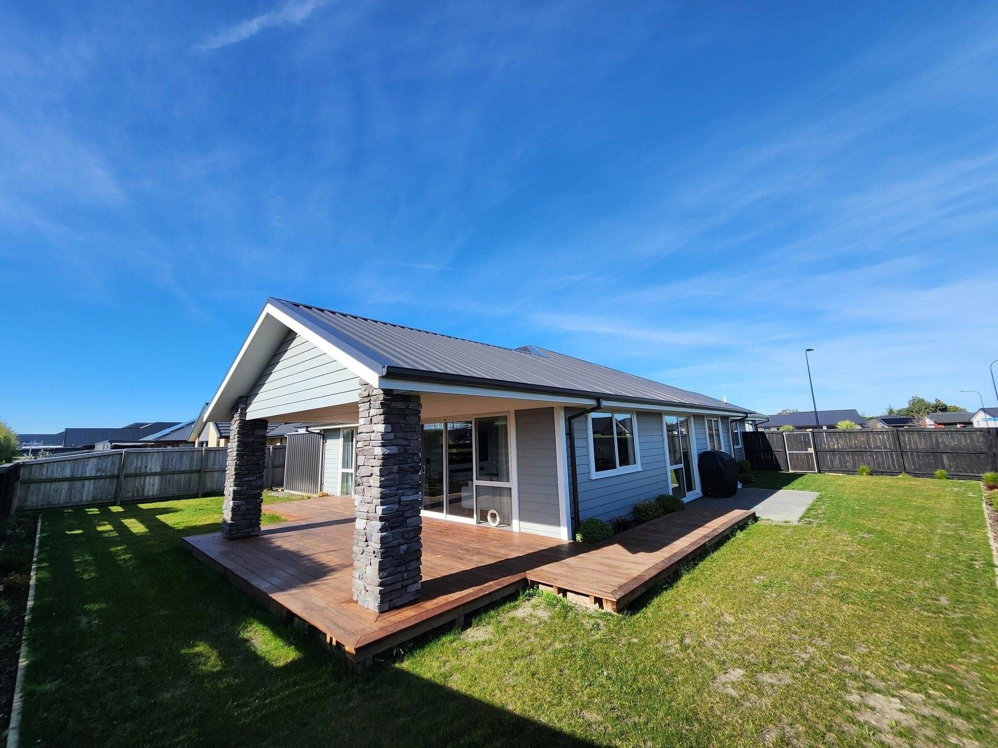 Bespoke four-bedroom home in Rolleston with schist columns and a covered deck