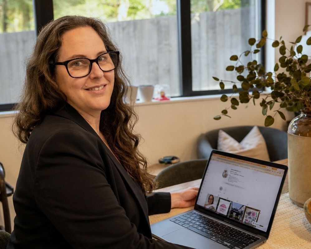 Anna Mollekin, freelance graphic designer at ALM Creative, working at her desk